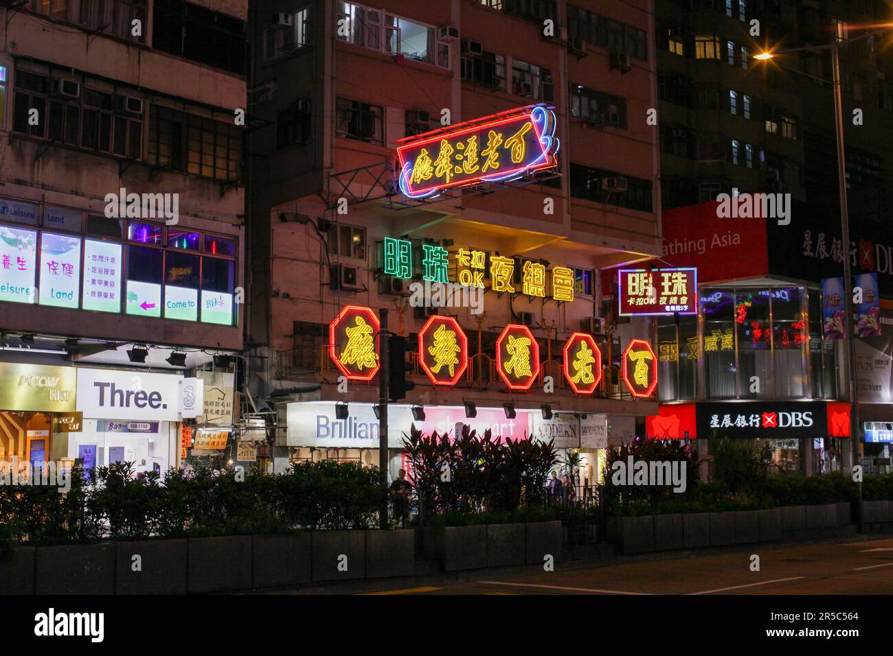 A vibrant night scene with neon lights of Hong Kong's Temple Street ...