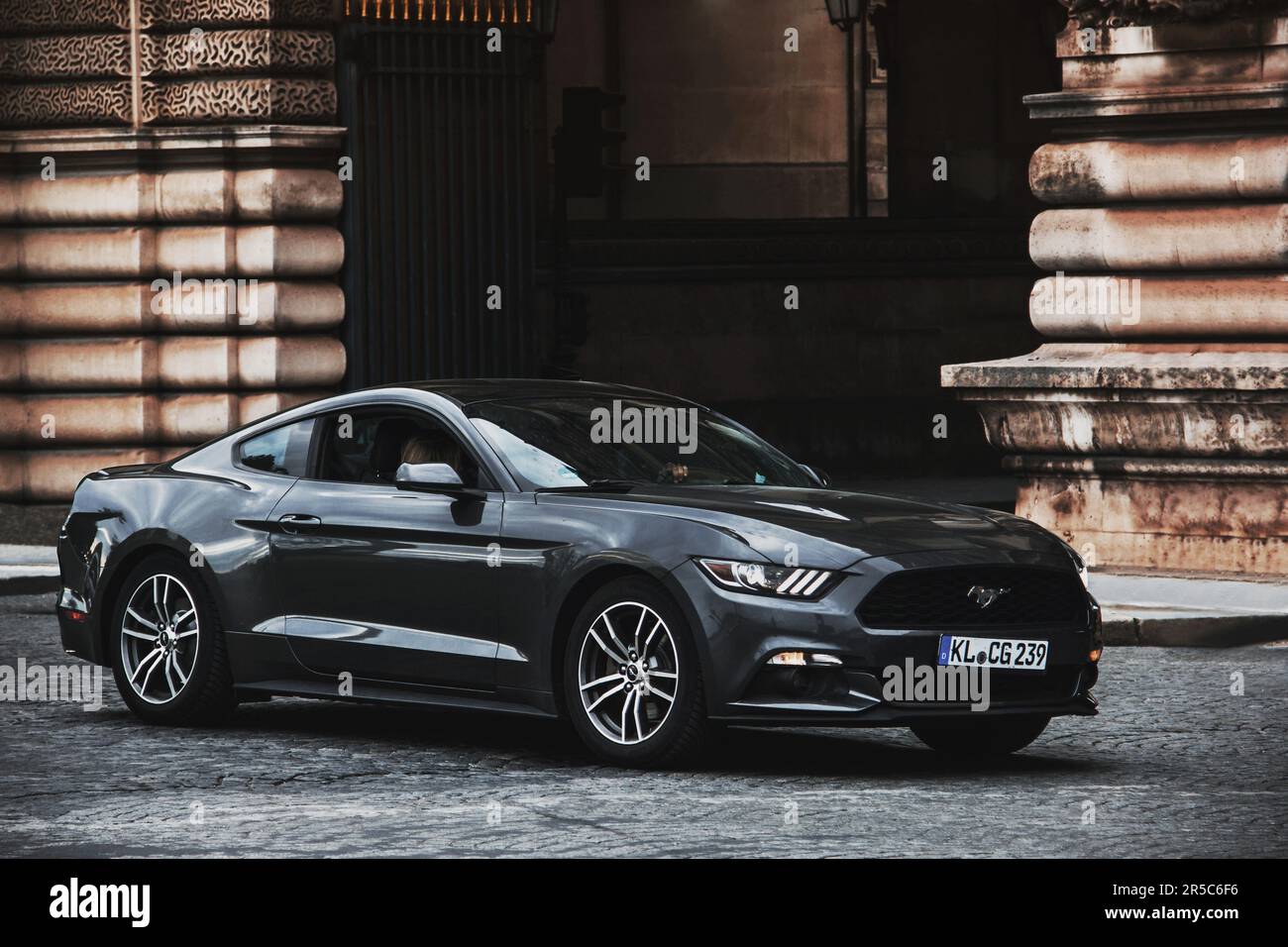 France, Paris - May 20, 2023: Gray Ford Mustang in the center of Paris Stock Photo