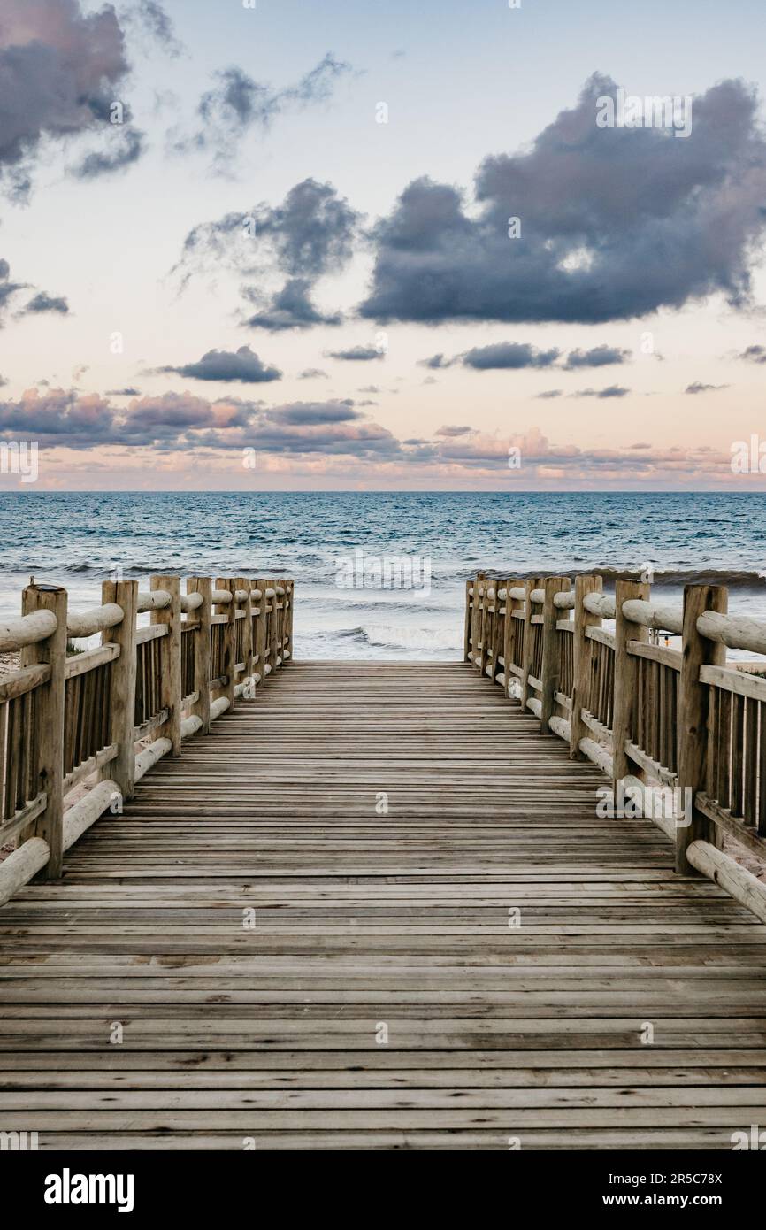 Long pier extending calm hi-res stock photography and images - Alamy