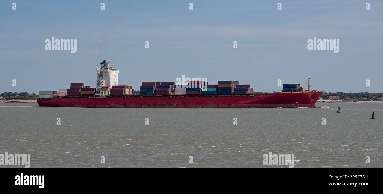 A container ship sails from Saint Nazaire in France Stock Photo
