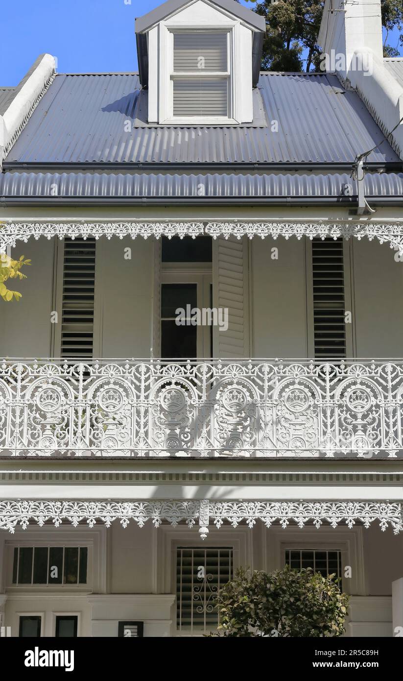 677 Facade of Victorian Filigree style terrace house with dormer window on Barcom Ave., Darlinghurst. Sydney-Australia. Stock Photo