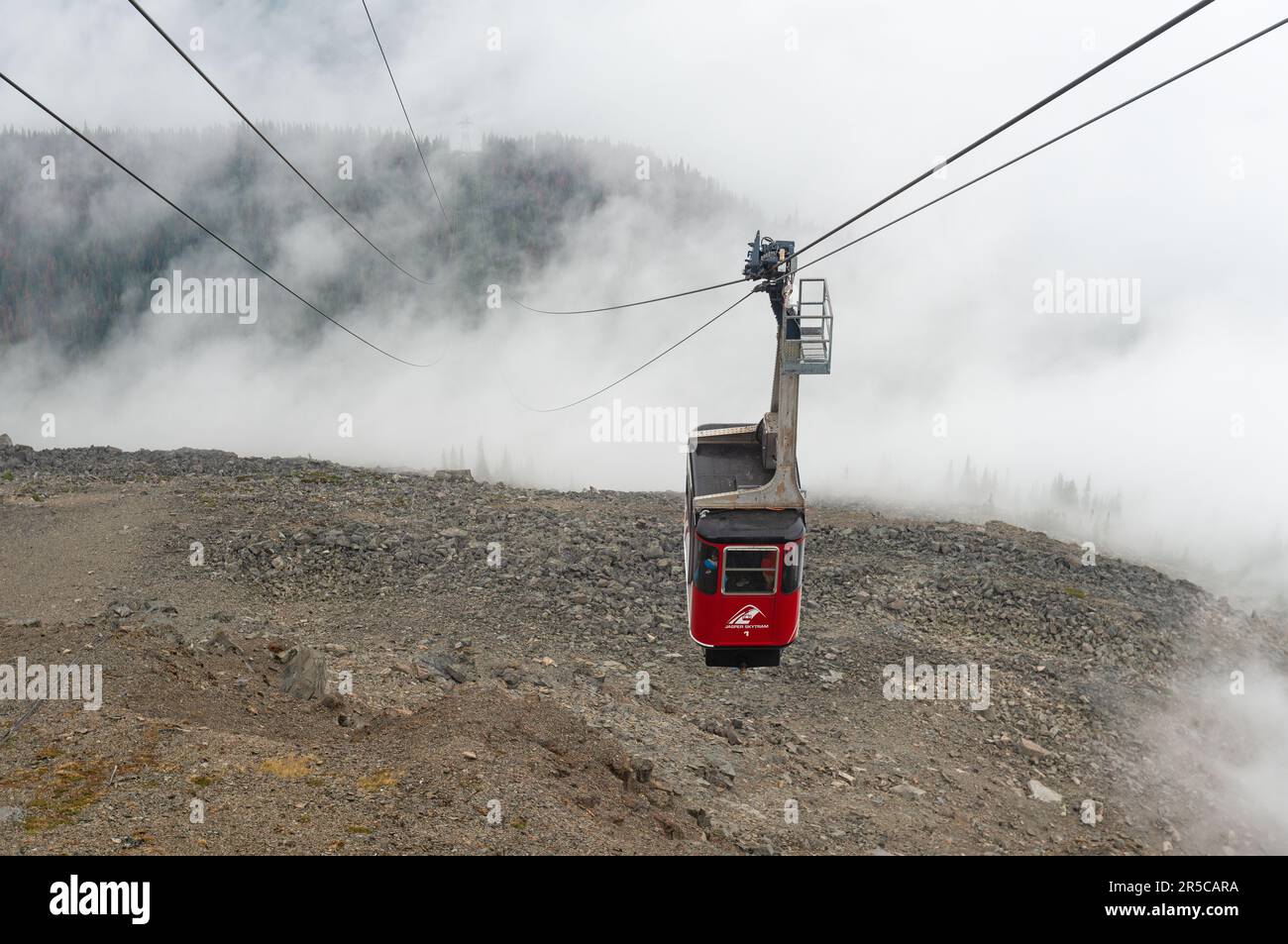 Cable car of the Jasper Skytram rising up through the mist to Mount Whistlers Mountain, Jasper national park, Canada Stock Photo