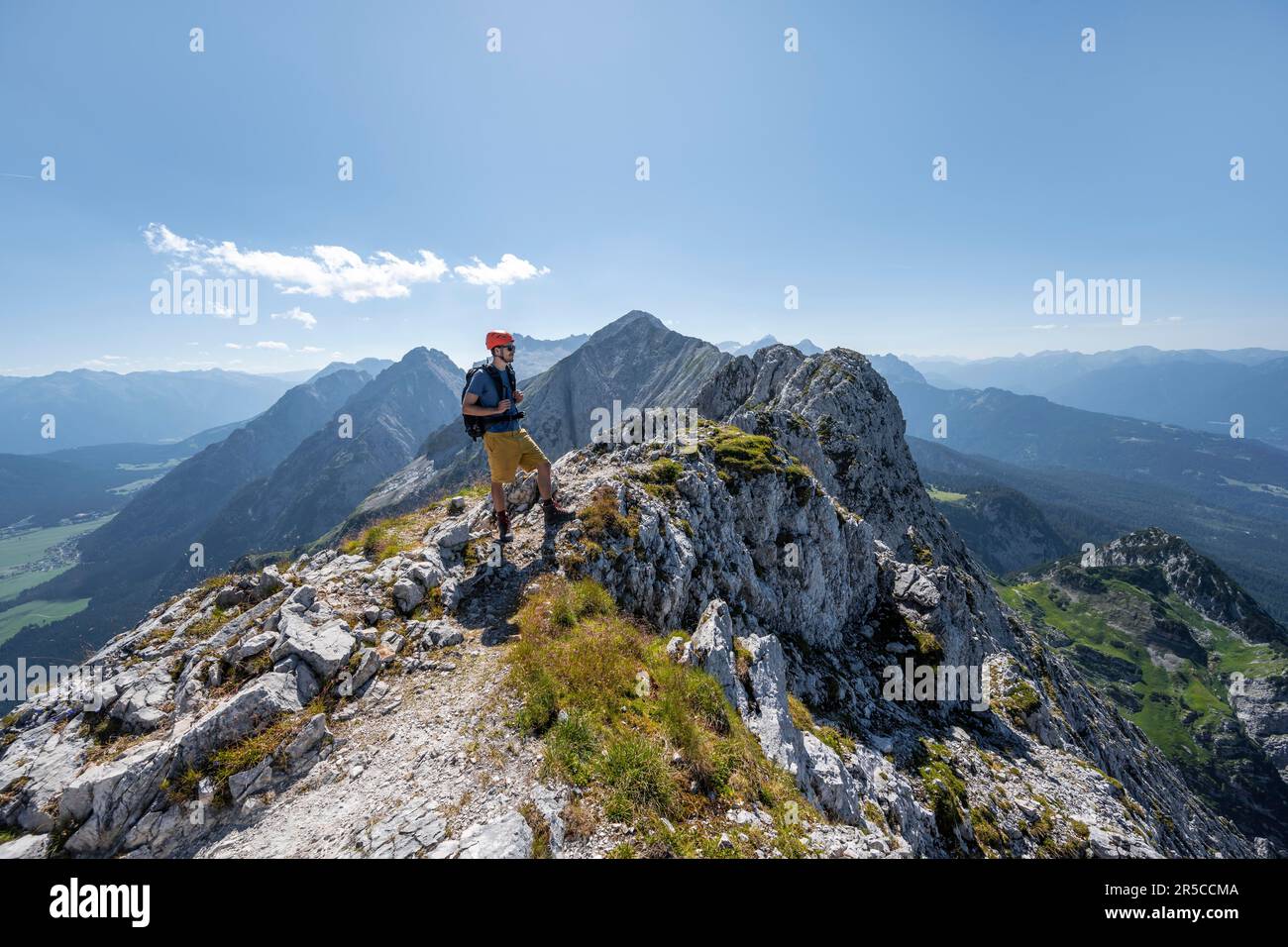 Climbers at the summit of the Upper Wettersteinspitze, view of the rocky ridge of the