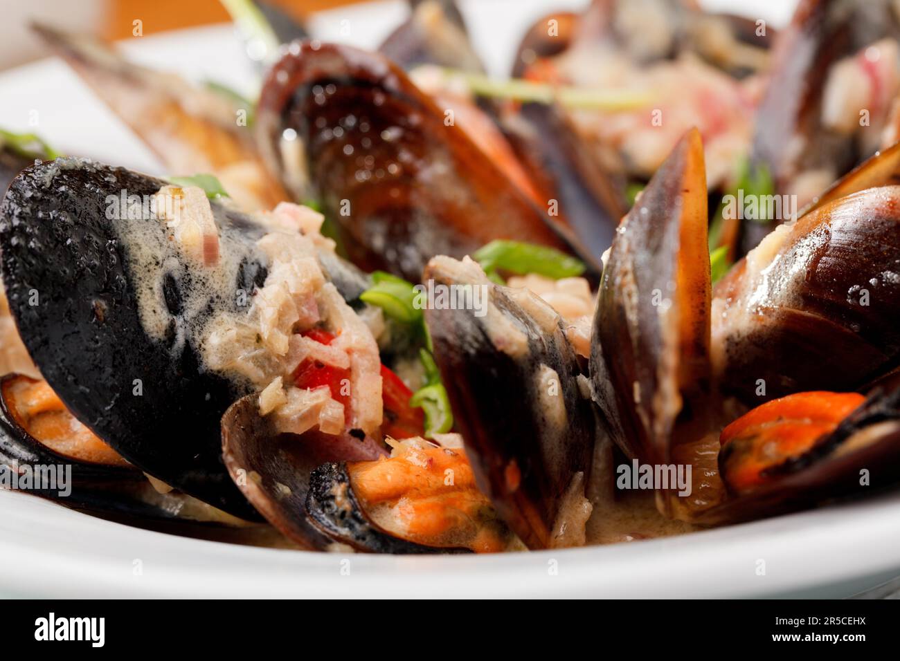 Fresh mussels in white wine sauce, with garlic, onion Stock Photo Alamy