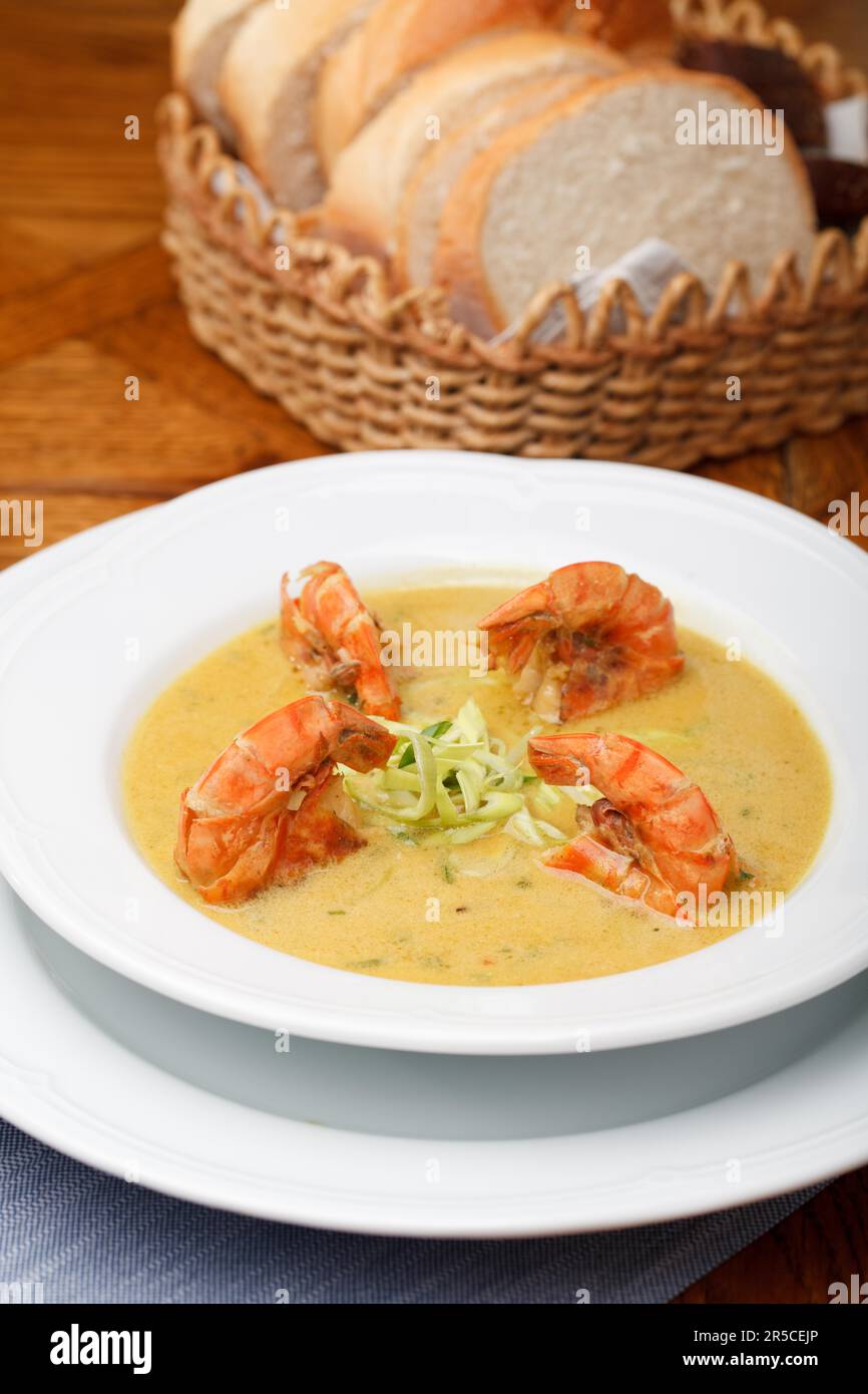 Spicy soup with shrimp in coconut milk Stock Photo - Alamy