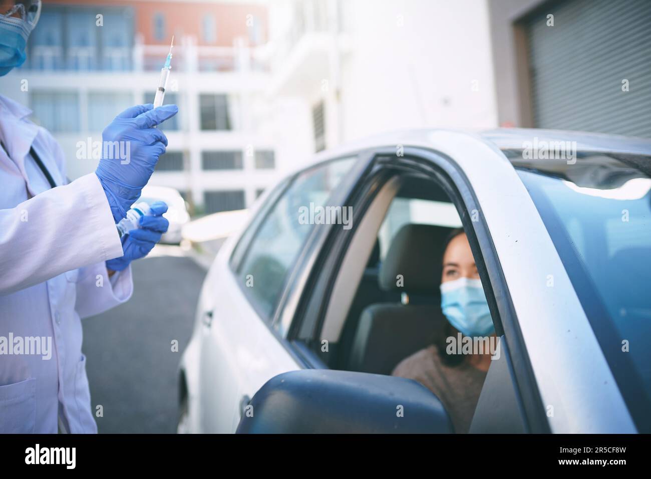 Every vaccination brings us closer to being better. a masked young ...