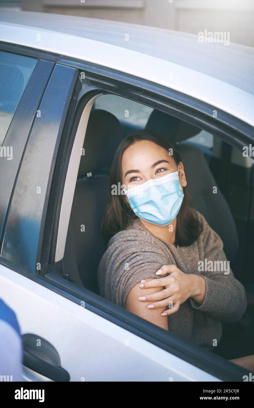 Every vaccination counts. a masked young woman getting a Covid-19 test ...