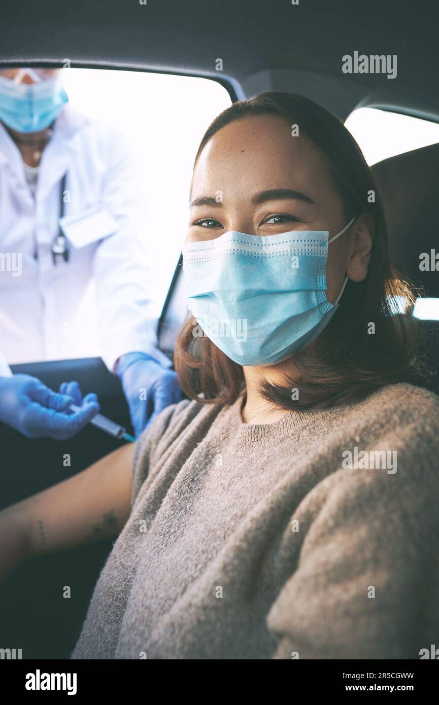 I chose the vaccine over the virus. a masked young woman receiving an ...