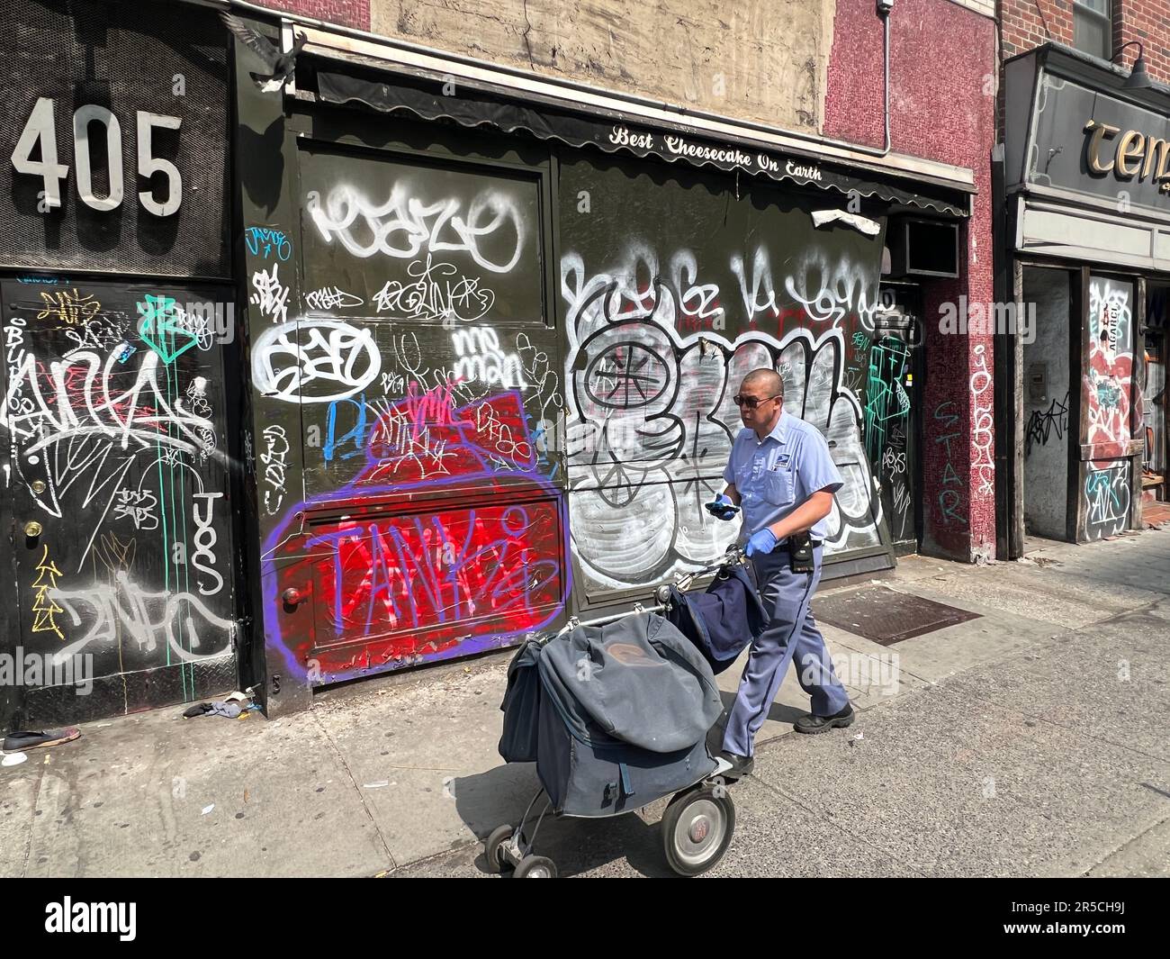 Ugly graffiti is still a problem in many neighborhoods in NYC like this block on the west side of midtown Manhattan. Stock Photo