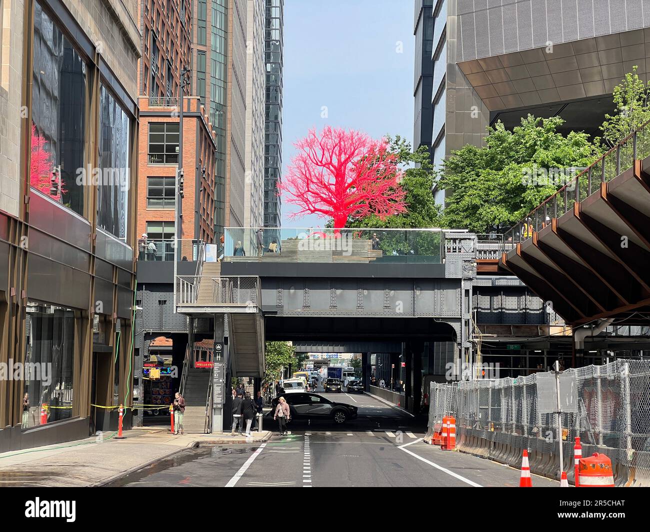 Pamela Rosenkranz presents 'Old Tree,' a bright red-and-pink sculpture. Metal pink tree seen on the High Line from 30th Street in Manhattan. Stock Photo