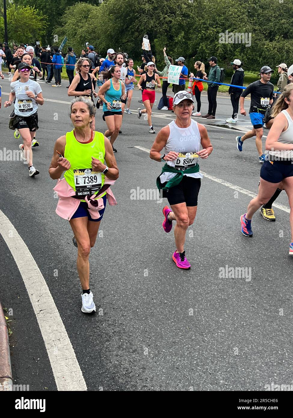 Runners come out of Prospect Park at the half way point of the Brooklyn Half Marathon on their way to the finish line at Coney Island on the Ocean. Stock Photo