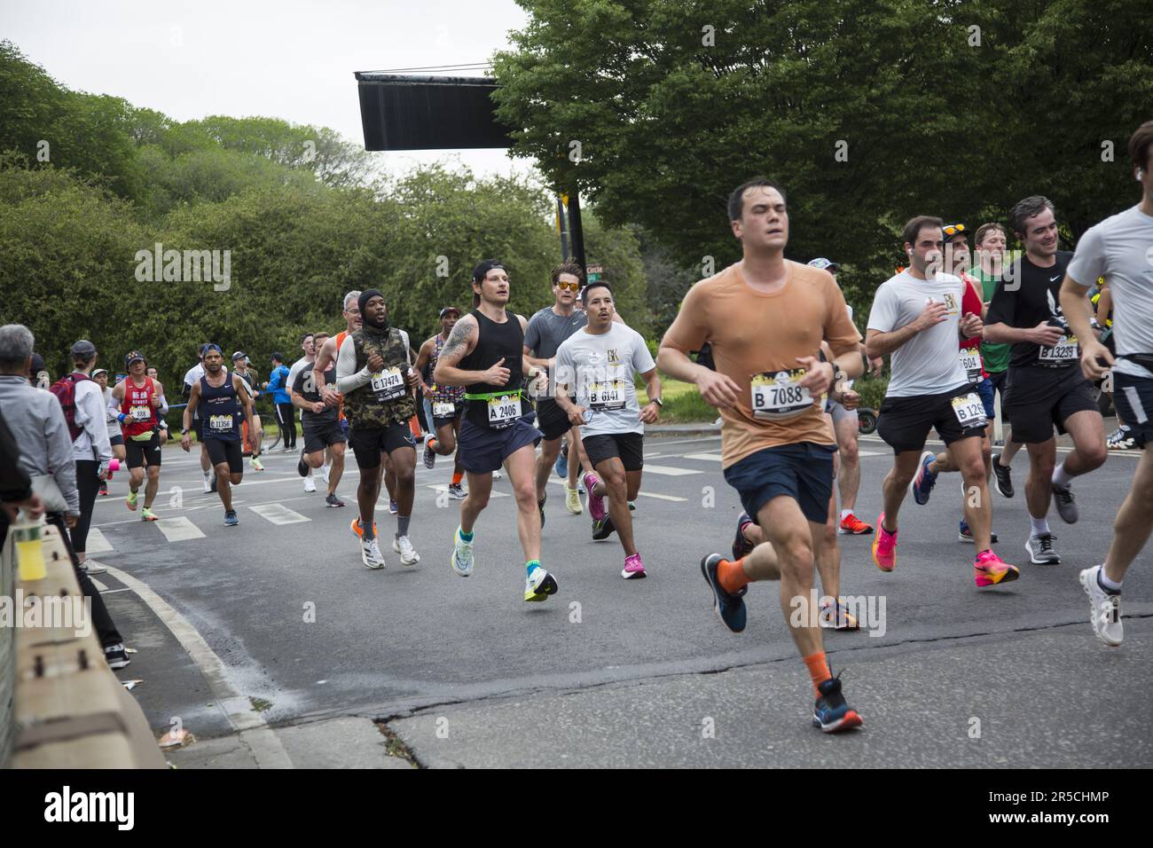 Runners come out of Prospect Park at the half way point of the Brooklyn Half Marathon on their way to the finish line at Coney Island on the Ocean. Stock Photo