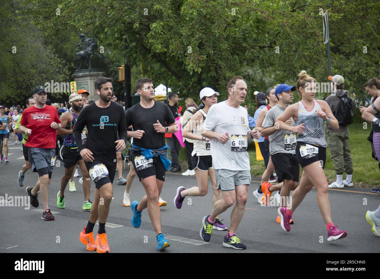 Runners come out of Prospect Park at the half way point of the Brooklyn Half Marathon on their way to the finish line at Coney Island on the Ocean. Stock Photo