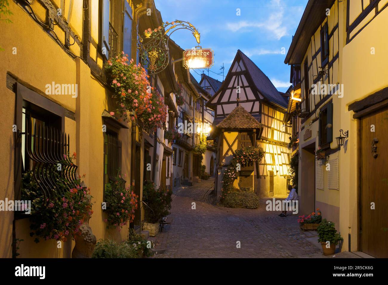 Alley with halftimbered houses in Eguisheim, Alsace, France Stock