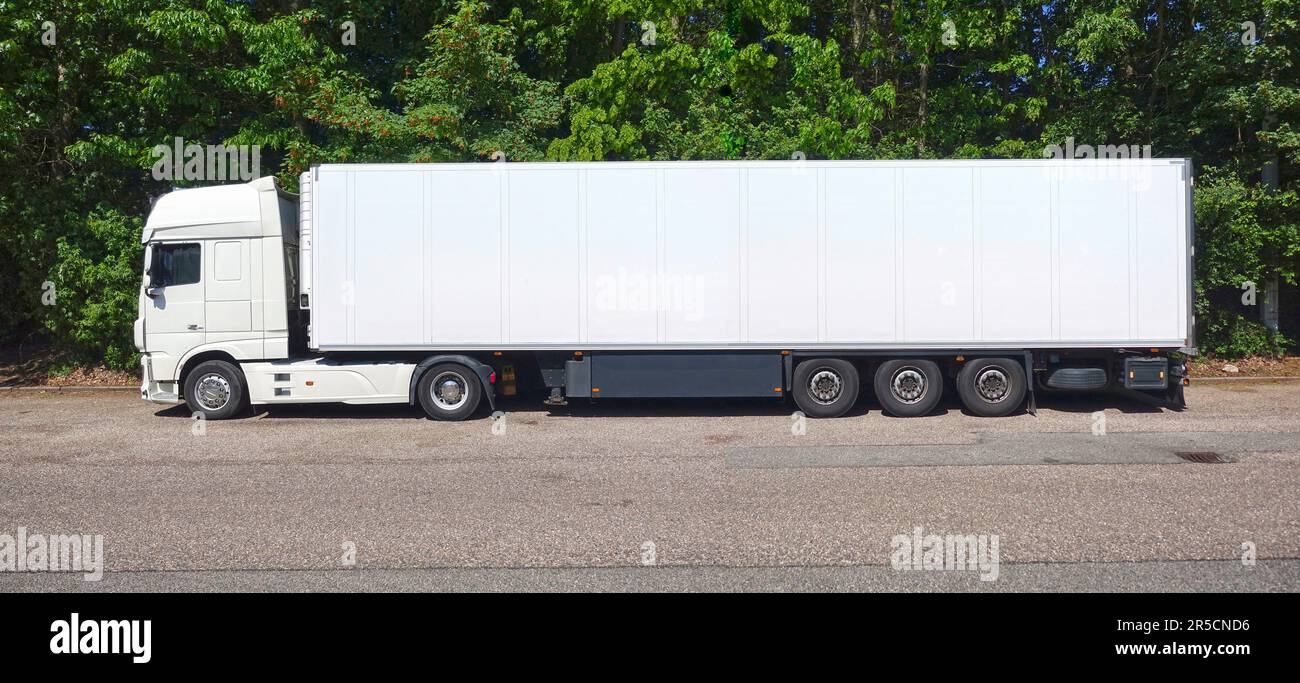 Parking white truck consisting of tractor unit and semitrailer Stock Photo