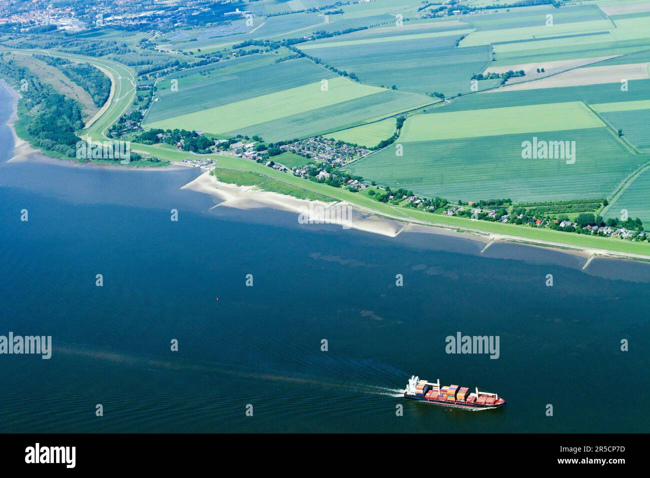 Container ship, Elbe, near Bielenberg and Gross-Kollmar, Elbe, Schleswig-Holstein, Germany Stock Photo