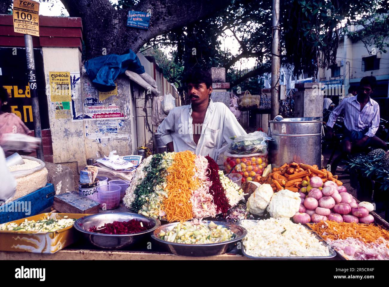 A man selling vegetable salads on the mobile cart at Coimbatore, Tamil