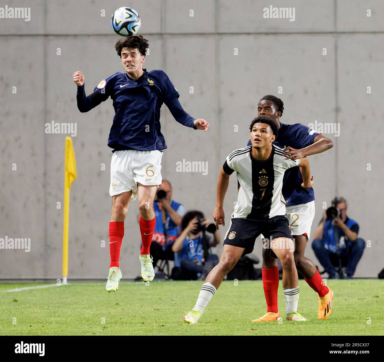 Budapest, Hungary. 2nd June, 2023. -(l-r) Nolan Ferro of France heads the ball in front of Paris Brunner of Germany and Yvann Titi of France during the UEFA European Under-17 Championship 2023 Final match between Germany and France at Hidegkuti Nandor Stadium on June 2, 2023 in Budapest, Hungary. Credit: Laszlo Szirtesi/Alamy Live News Stock Photo