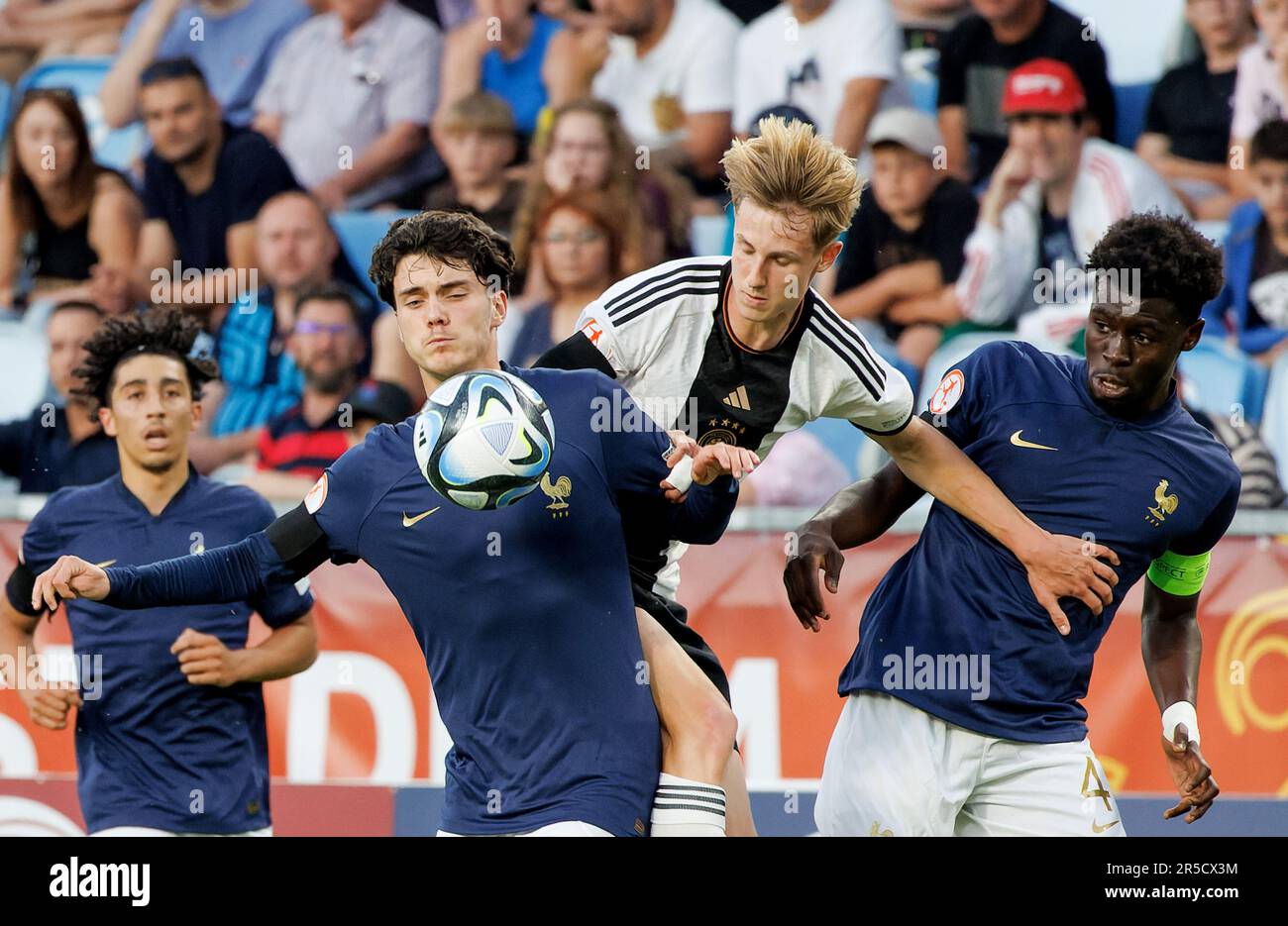 Budapest, Hungary. 2nd June, 2023. Fayssal Harchaoui of Germany fights for the possession with Nolan Ferro of France (l) and Joachim Kayi Sanda of France (r) during the UEFA European Under-17 Championship 2023 Final match between Germany and France at Hidegkuti Nandor Stadium on June 2, 2023 in Budapest, Hungary. Credit: Laszlo Szirtesi/Alamy Live News Stock Photo