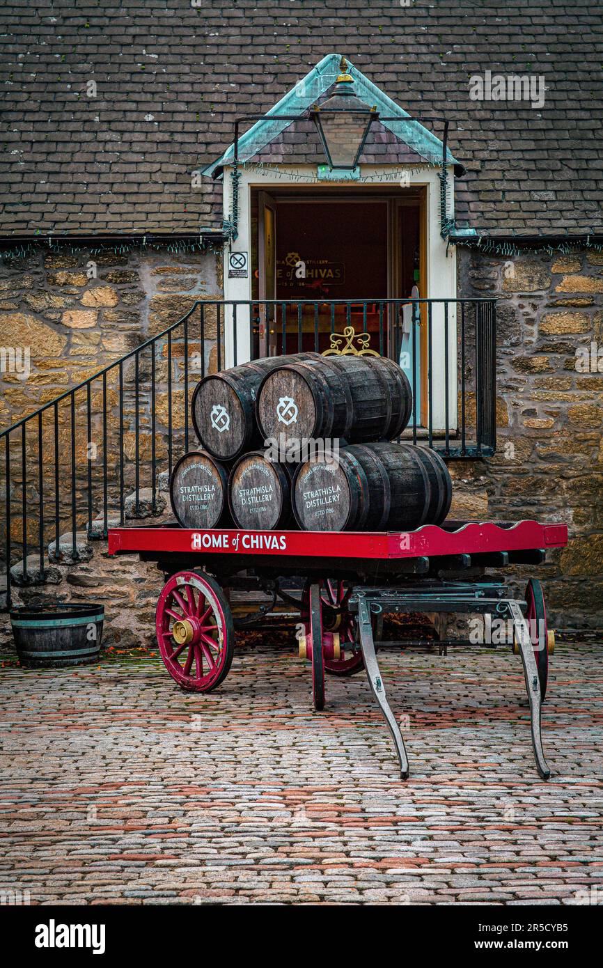 Wooden whisky barrels on an old cart in Strathisla distillery, Keith, United Kingdom Stock Photo