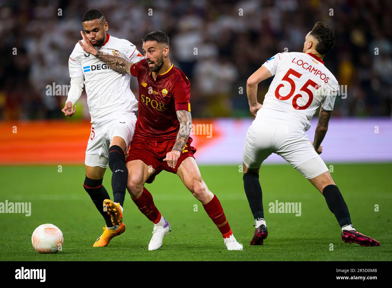 Budapest, Hungary. 31 May 2023. Leonardo Spinazzola of AS Roma competes for the ball with Lucas Ocampos and Youssef En-Nesyri of Sevilla FC during the UEFA Europa League final football match between Sevilla FC and AS Roma. Credit: Nicolò Campo/Alamy Live News Stock Photo