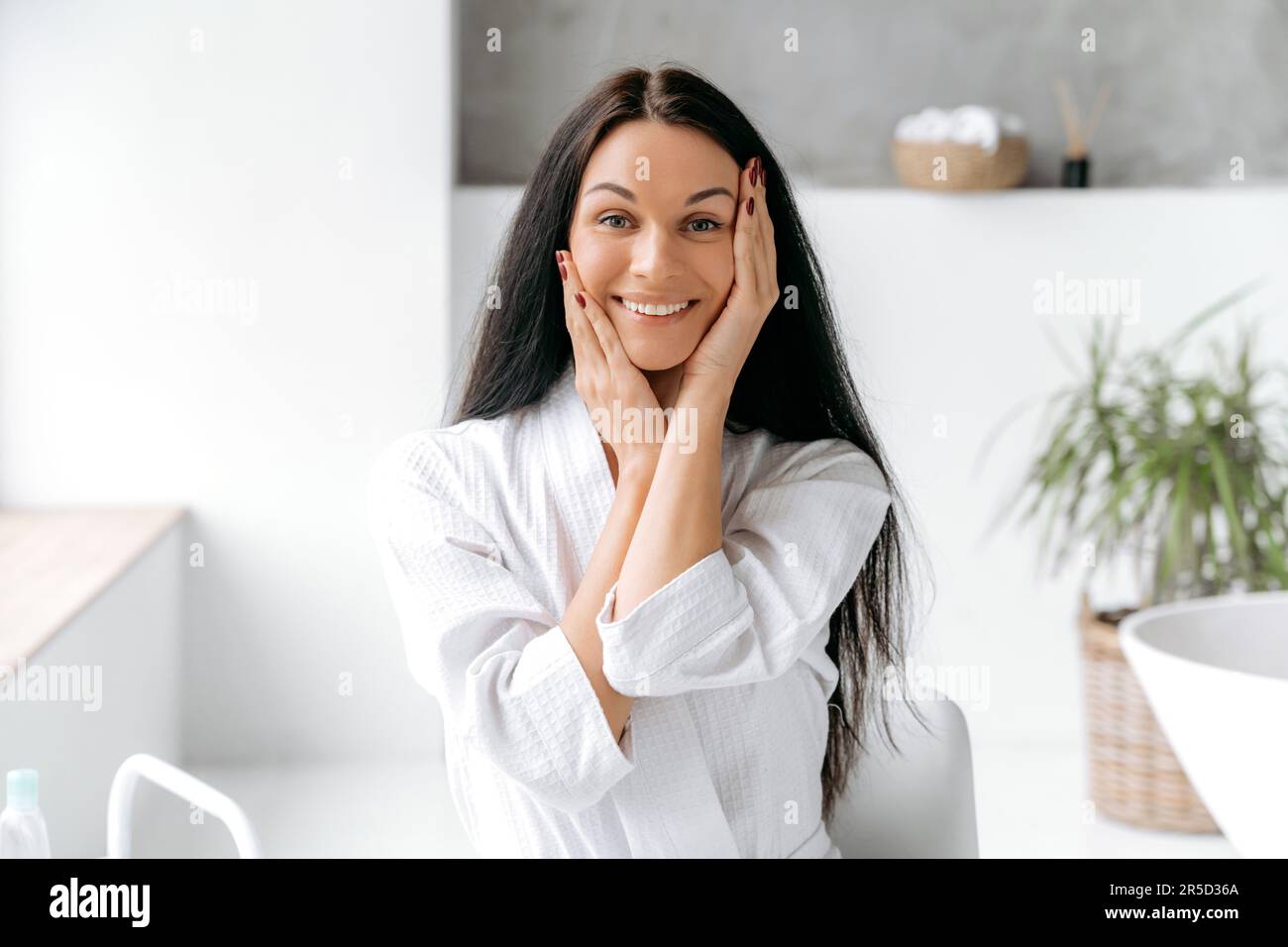 Photo of a beautiful wellgroomed caucasian young woman with long black