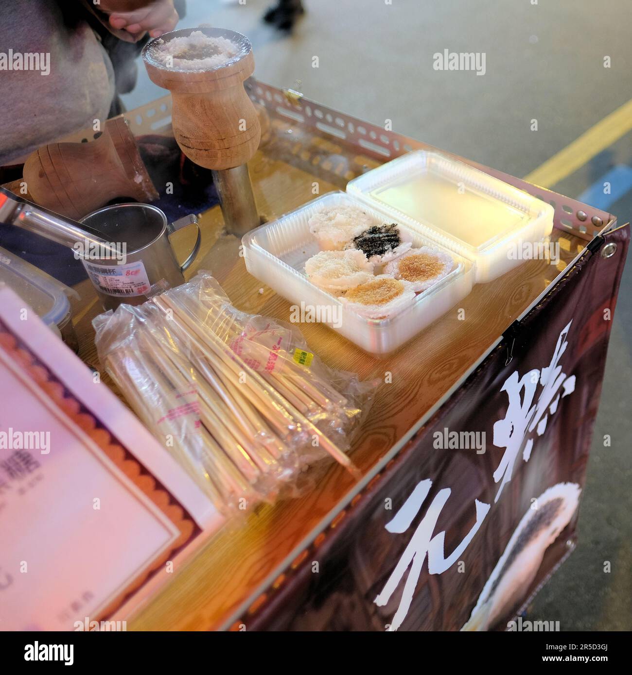 Steamed rice cake stand at Huaxi Street Tourist Night Market in Taipei, Taiwan; sweet rice dessert food cart; traditional Taiwanese food. Stock Photo