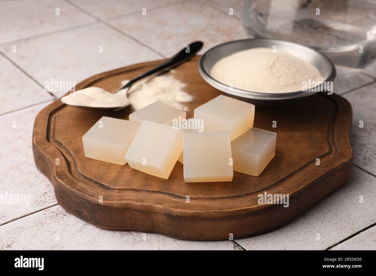 Agaragar jelly cubes and powder on tiled surface Stock Photo Alamy