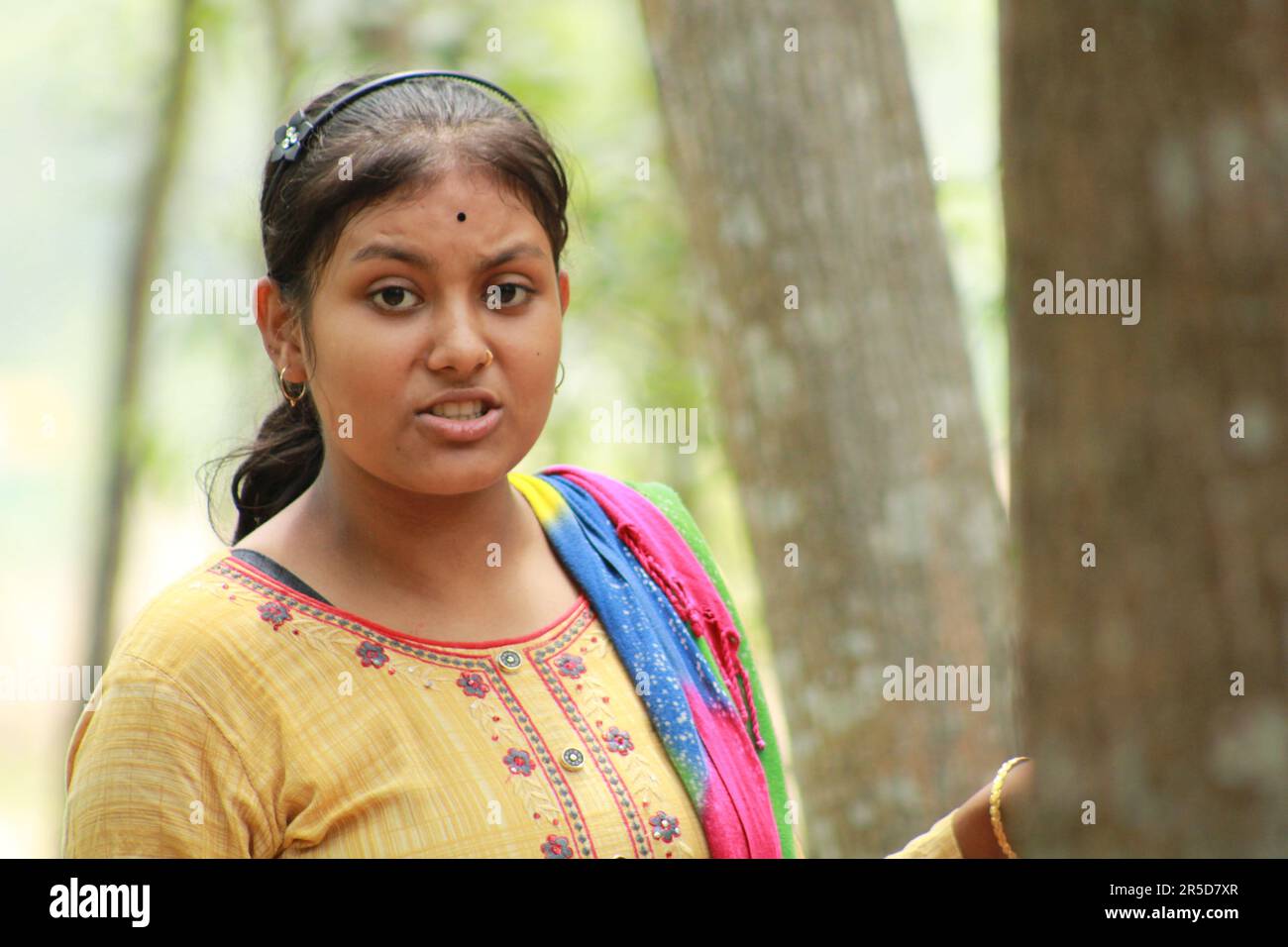 A young beautiful Indian Teenage girl portrait with smiling expression 