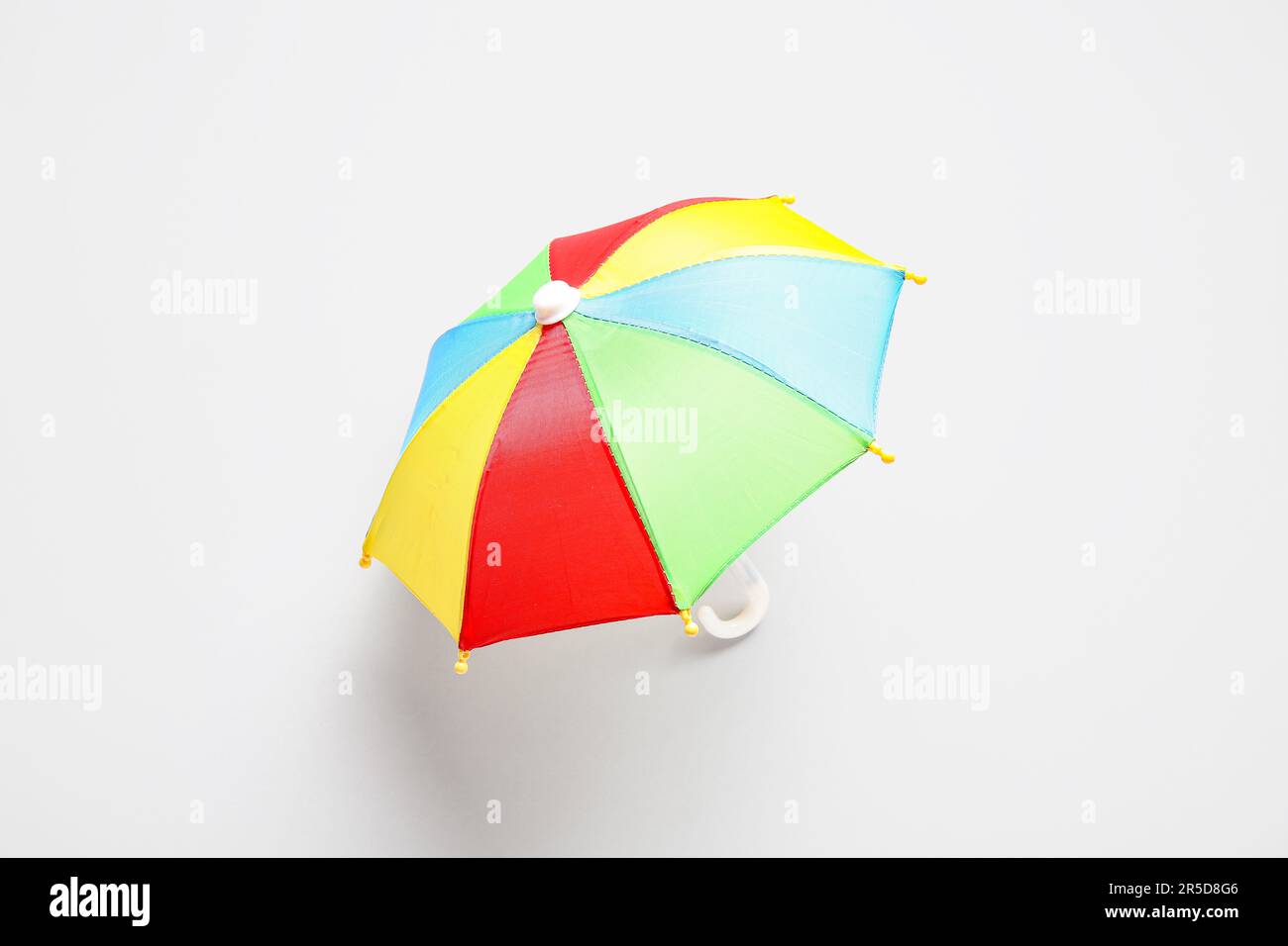 Mini colorful umbrella on white background Stock Photo