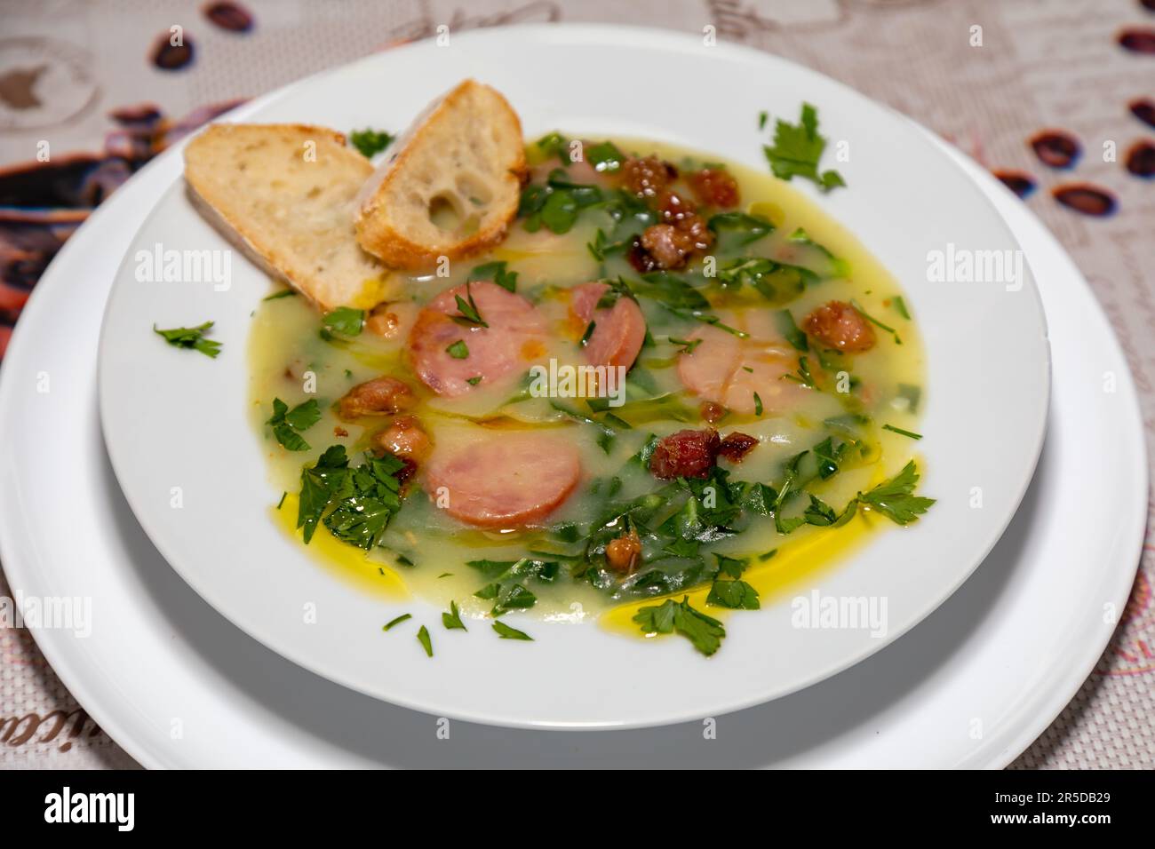 Traditional Portuguese style soup called Caldo Verde with traditional bread. 'comida de verdade' Stock Photo