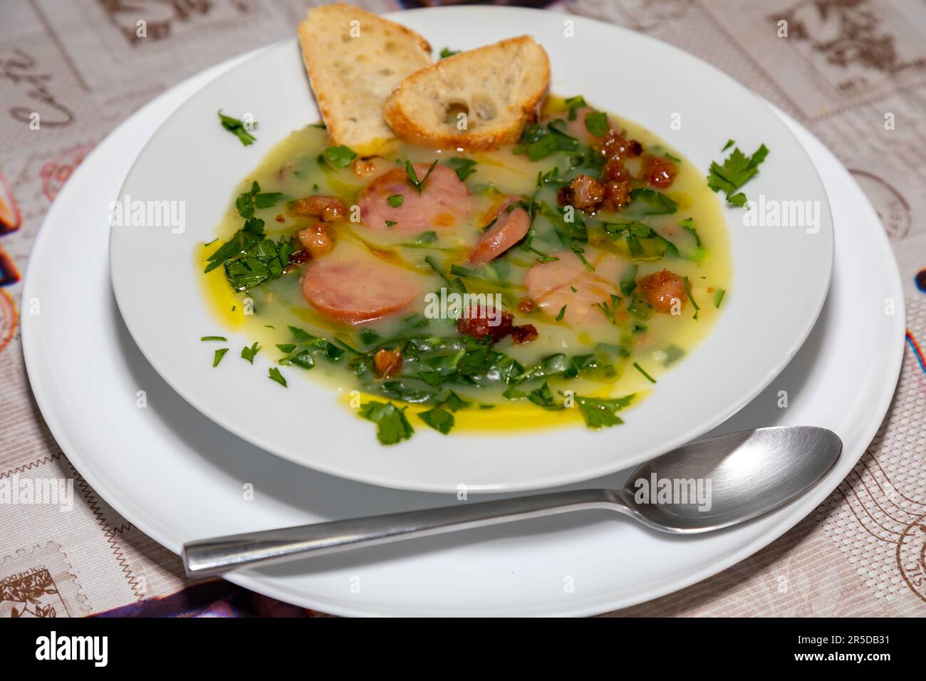Traditional Portuguese style soup called Caldo Verde with traditional bread. 'comida de verdade' Stock Photo