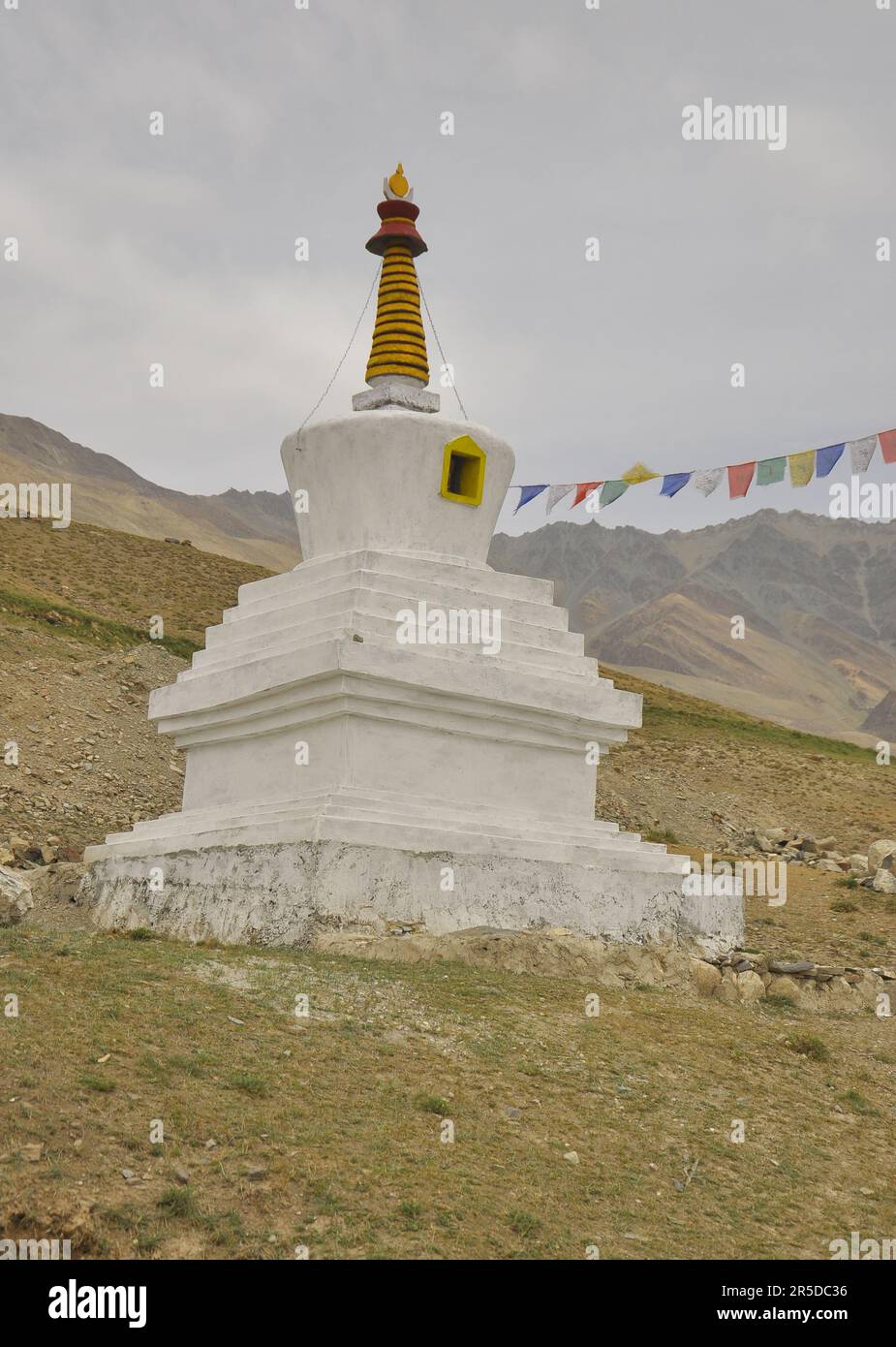 A Buddhist white stupa on rocky mountains of Ladakh, INDIA Stock Photo ...