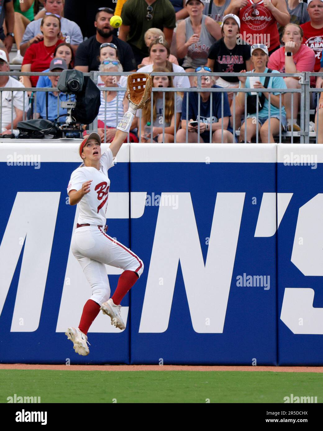 Alabama's Jenna Johnson catches a fly ball by Stanford's Aly Kaneshiro during the sixth inning