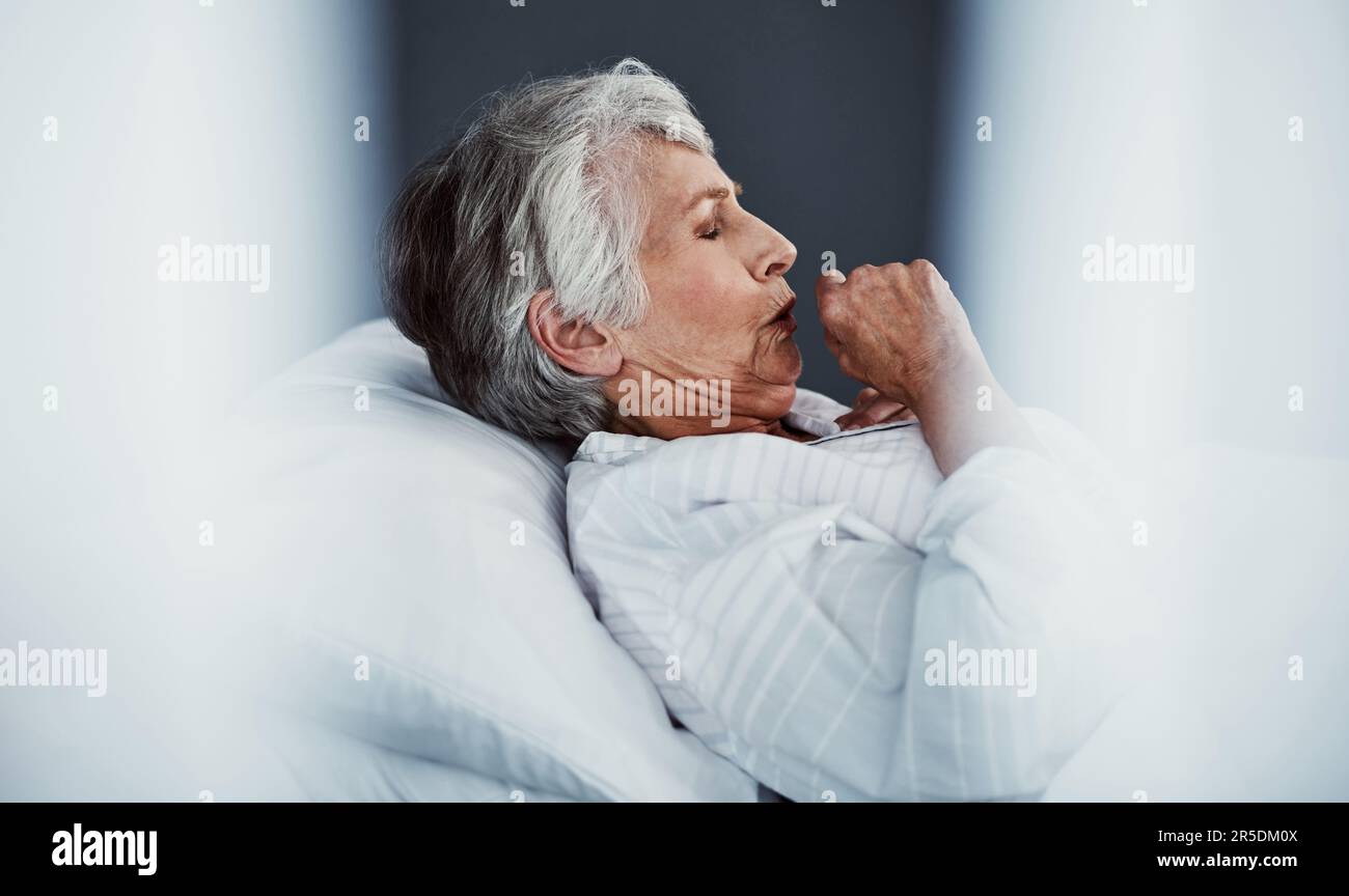 Shes got a chest infection. High angle shot of a sickly senior woman