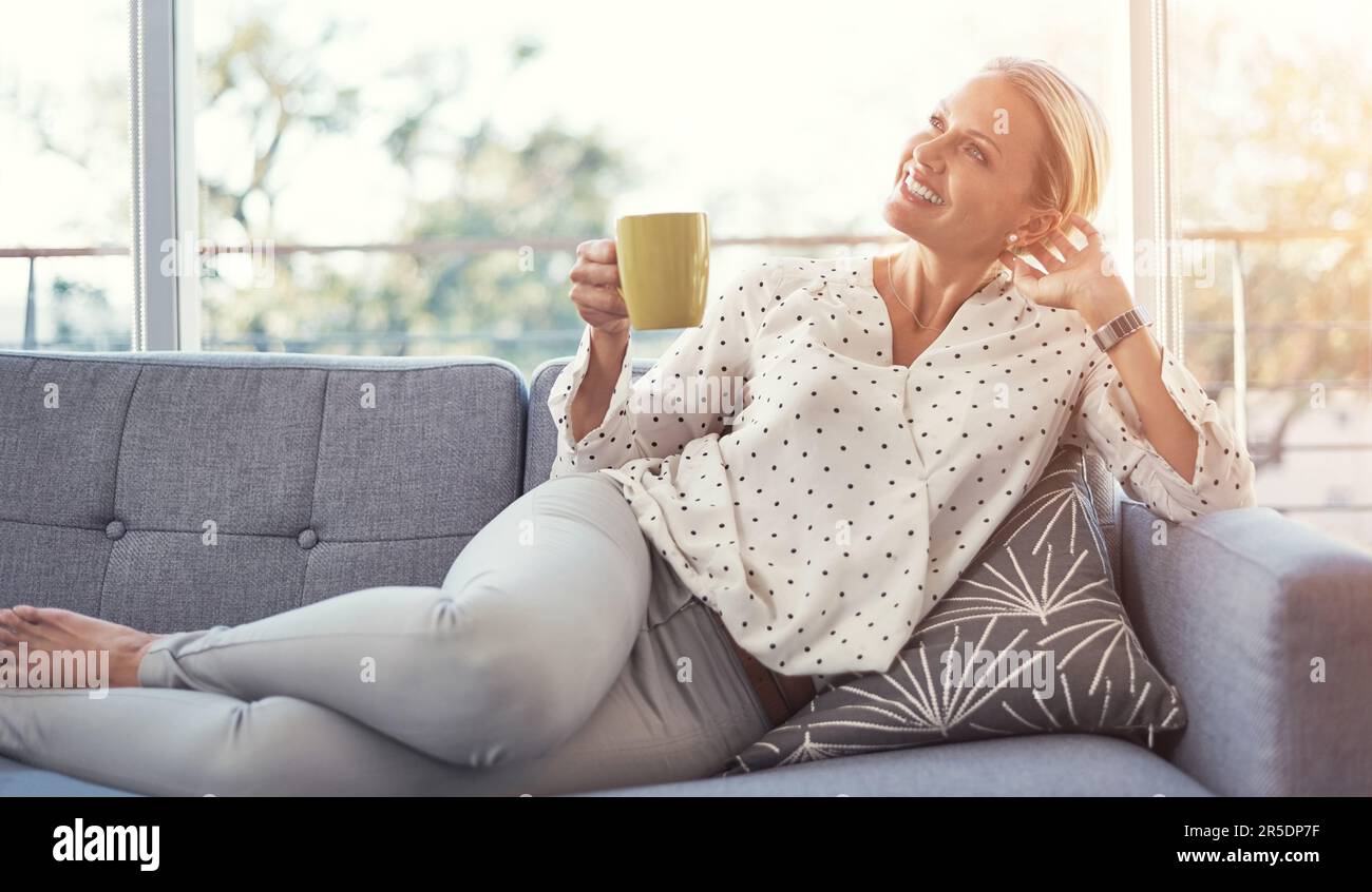 Mature woman relaxing sofa inside hi-res stock photography and images ...