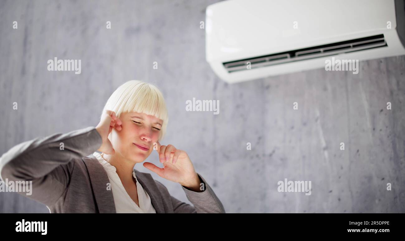 Air conditioner Noise Sound And Headache Stress Stock Photo Alamy