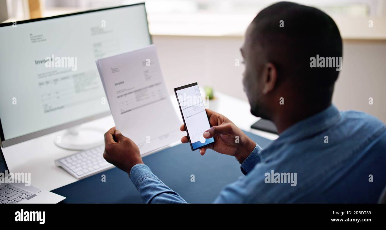 Taking Invoice Document Photo Using Phone Or Smartphone Stock Photo