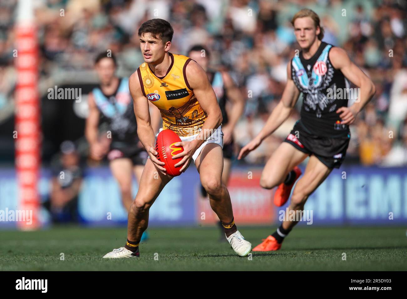 Adelaide, Australia. 03rd June, 2023. Conor Nash of the Hawks is tackled by  Dan Houston and Riley Bonner of the Power during the AFL Round 12 match  between the Port Adelaide Power