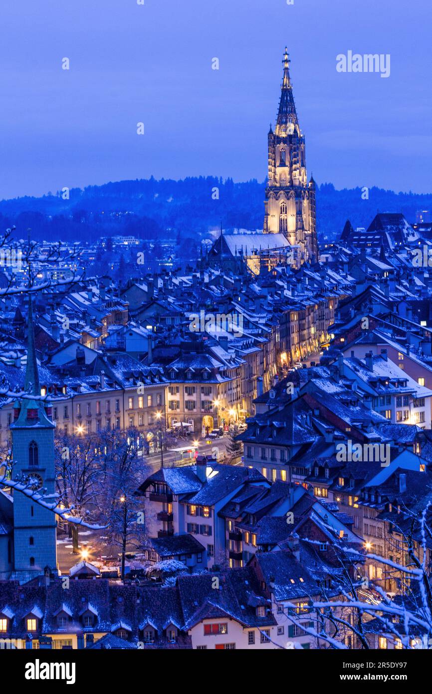 Town center of Bern in winter blue hour with snowy and illuminated buildings, Rosengarten, Bern, UNESCO, Switzerland Stock Photo
