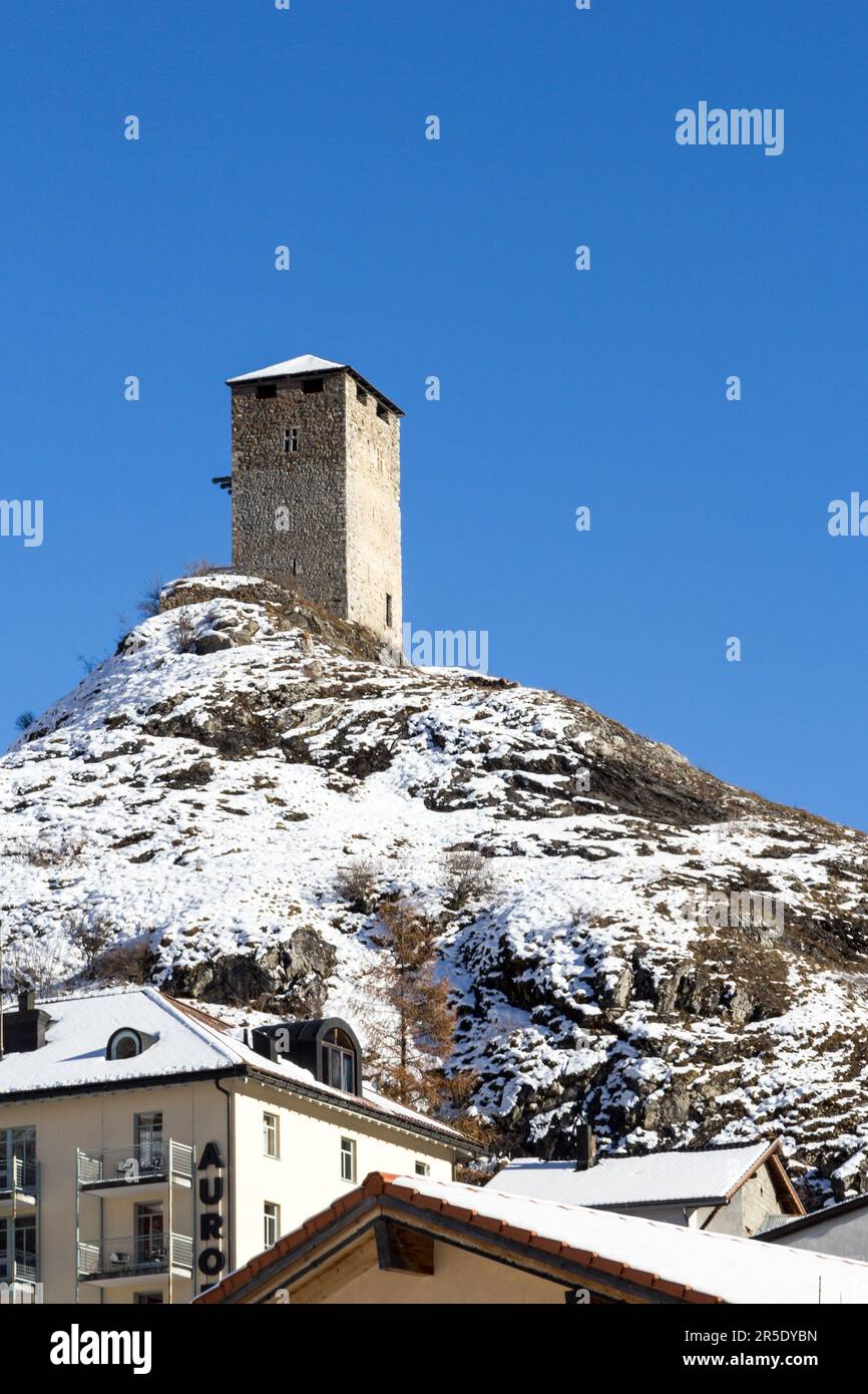 Ardez, Switzerland - December 03. 2121: The old medieval castle Steinsberg over the village Ardez in Swiss Alps. Engadin valley, Canton Grisons, Switz Stock Photo