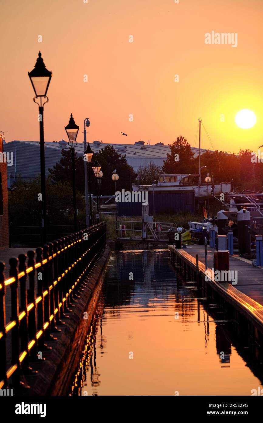 Sovereign Harbour Eastbourne at sunset with reflections of boats and