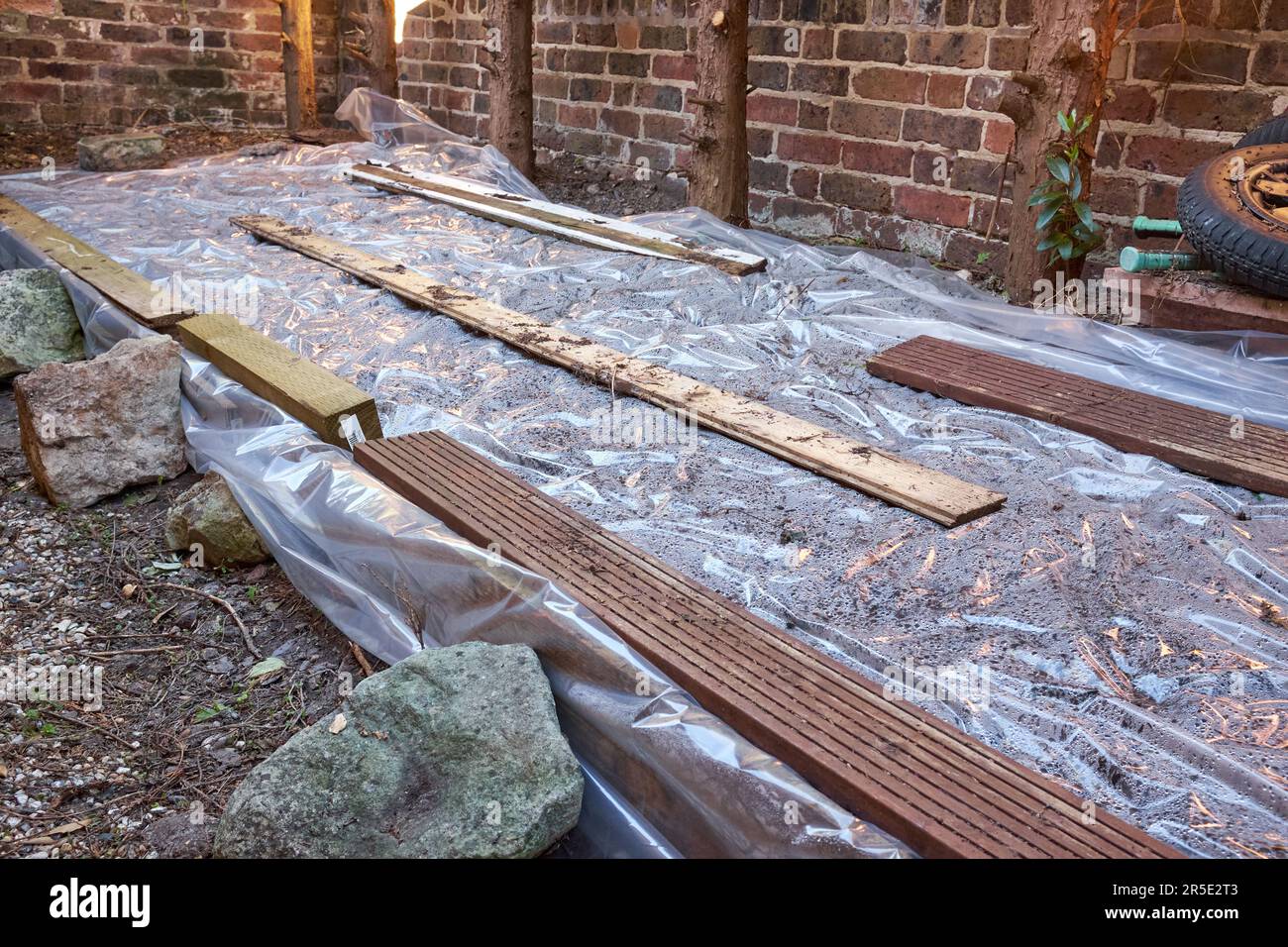 Soil solarisation is a chemical-free method of weed control that uses the sun's heat to sterilise soil. Stock Photo