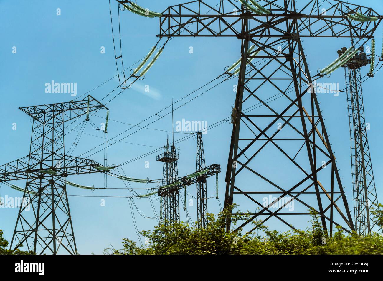 High voltage towers with sky background. Power line support with wires ...