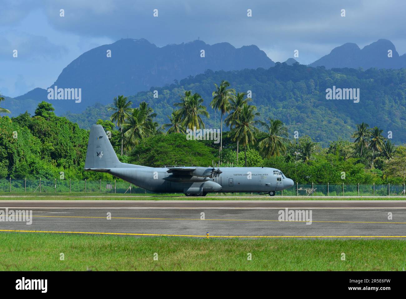 Langkawi, Malaysia - May 28, 2023. Lockheed C-130H-30 Hercules M30-12 TUDM of Royal Malaysian Air Force taxiing for takeoff from Langkawi Airport (LGK Stock Photo