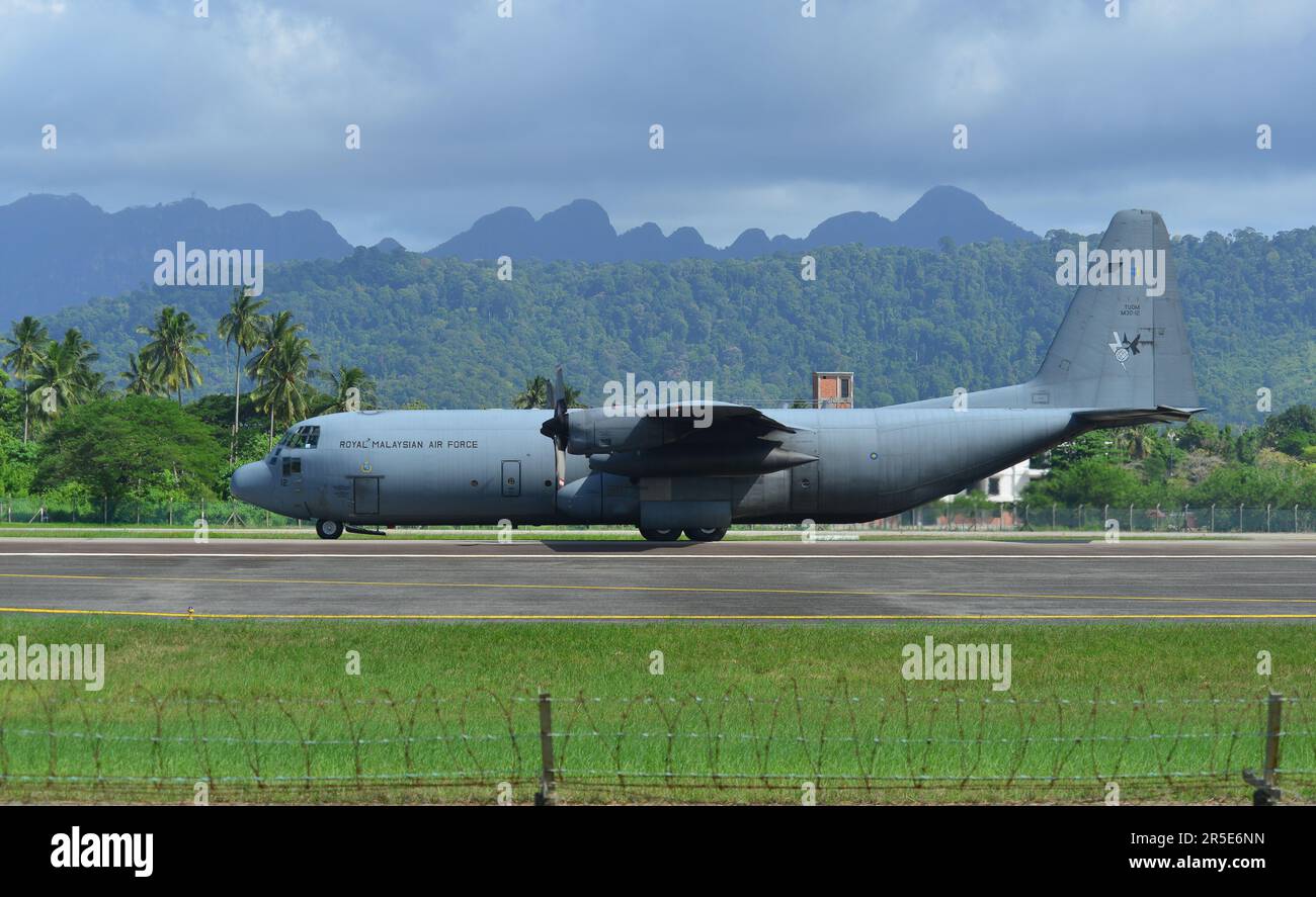 Langkawi, Malaysia - May 28, 2023. Lockheed C-130H-30 Hercules M30-12 TUDM of Royal Malaysian Air Force taxiing for takeoff from Langkawi Airport (LGK Stock Photo