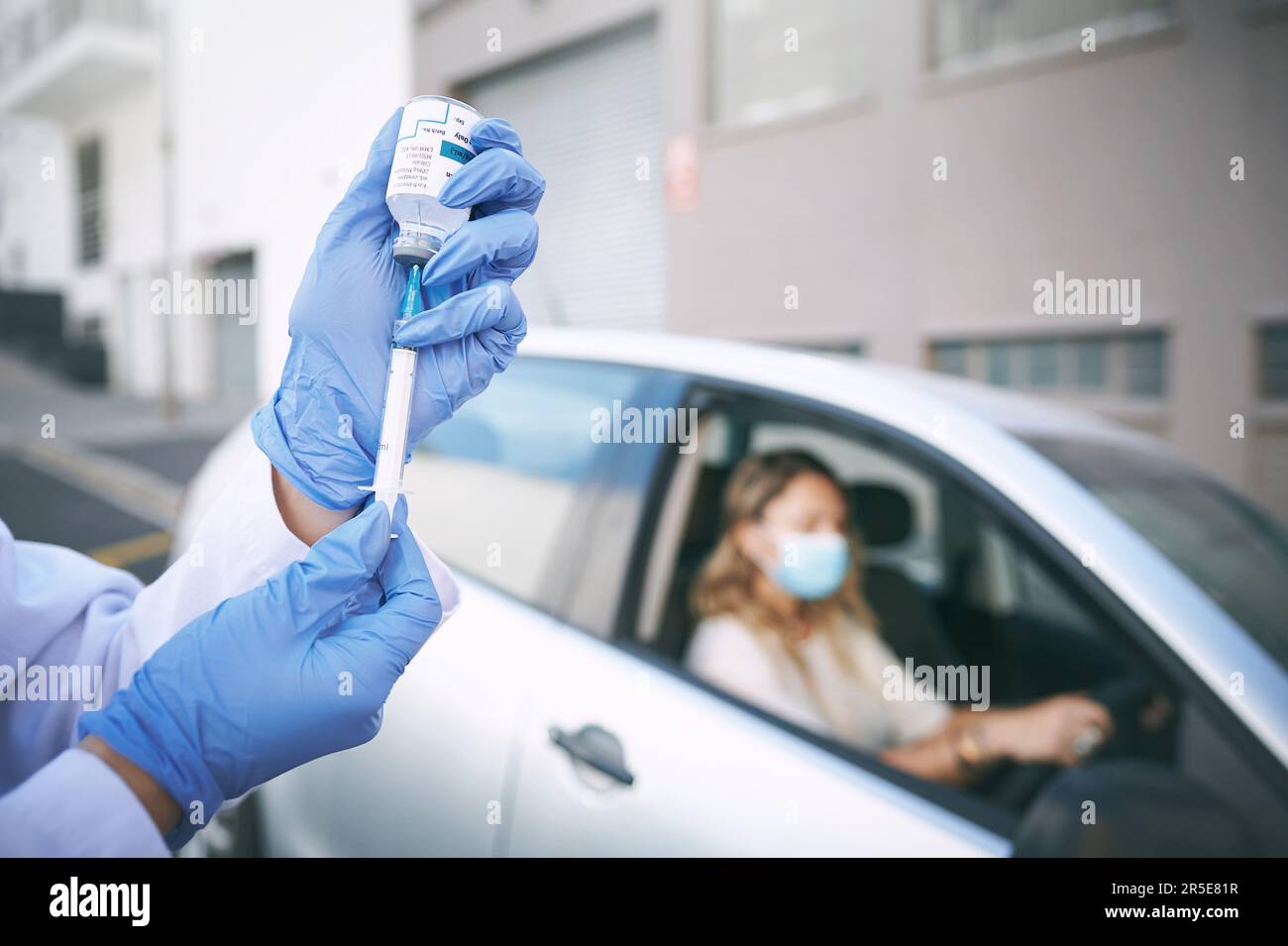 Every shot saves a life. a doctor giving a patient an injection at a ...