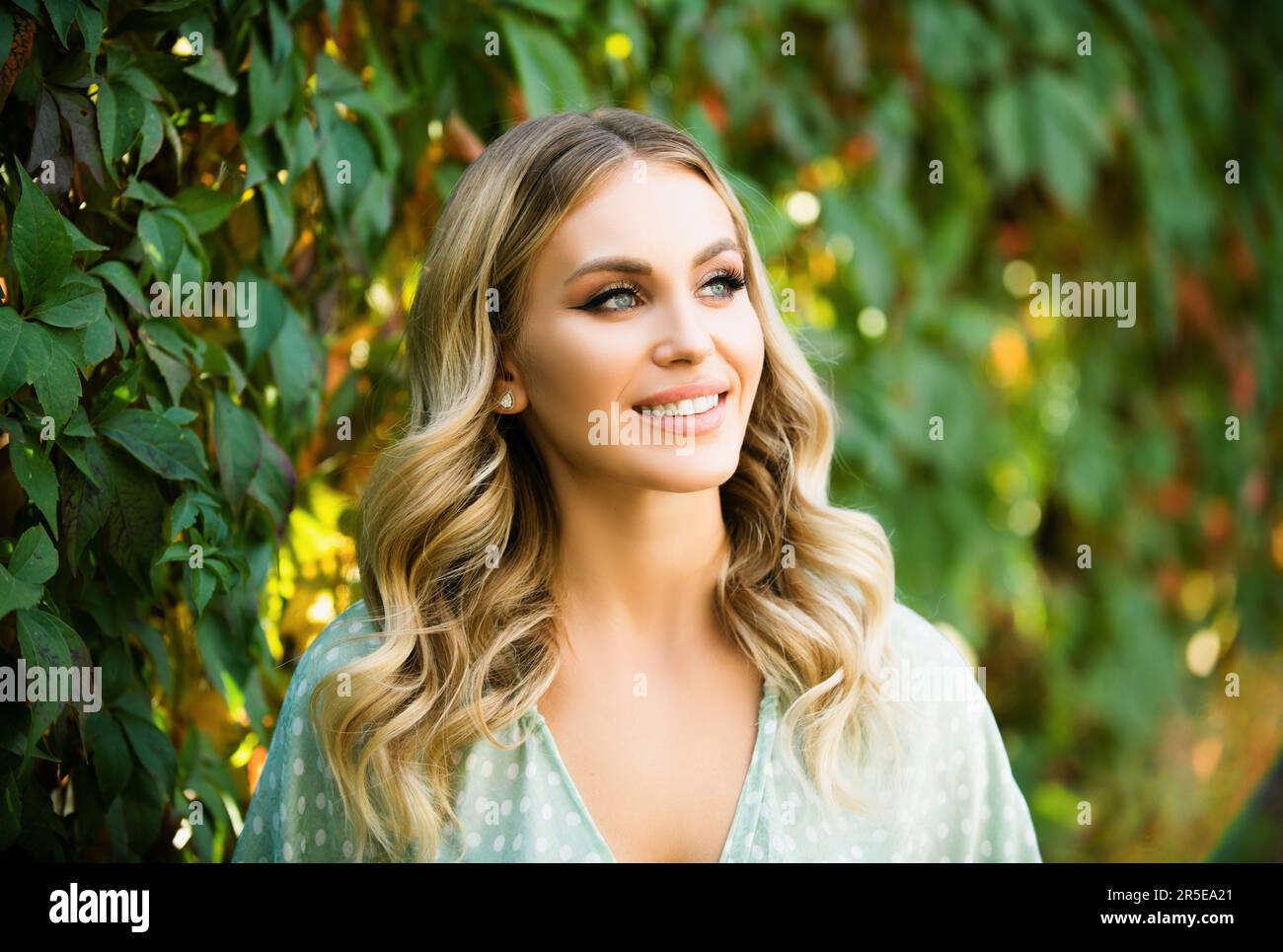 Portrait of a young woman, close up face of beautiful woman in park ...