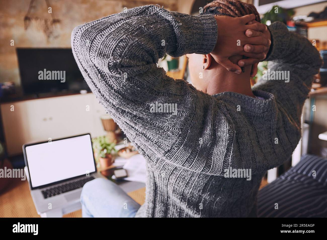 Sitting hands behind the head hi-res stock photography and images - Alamy