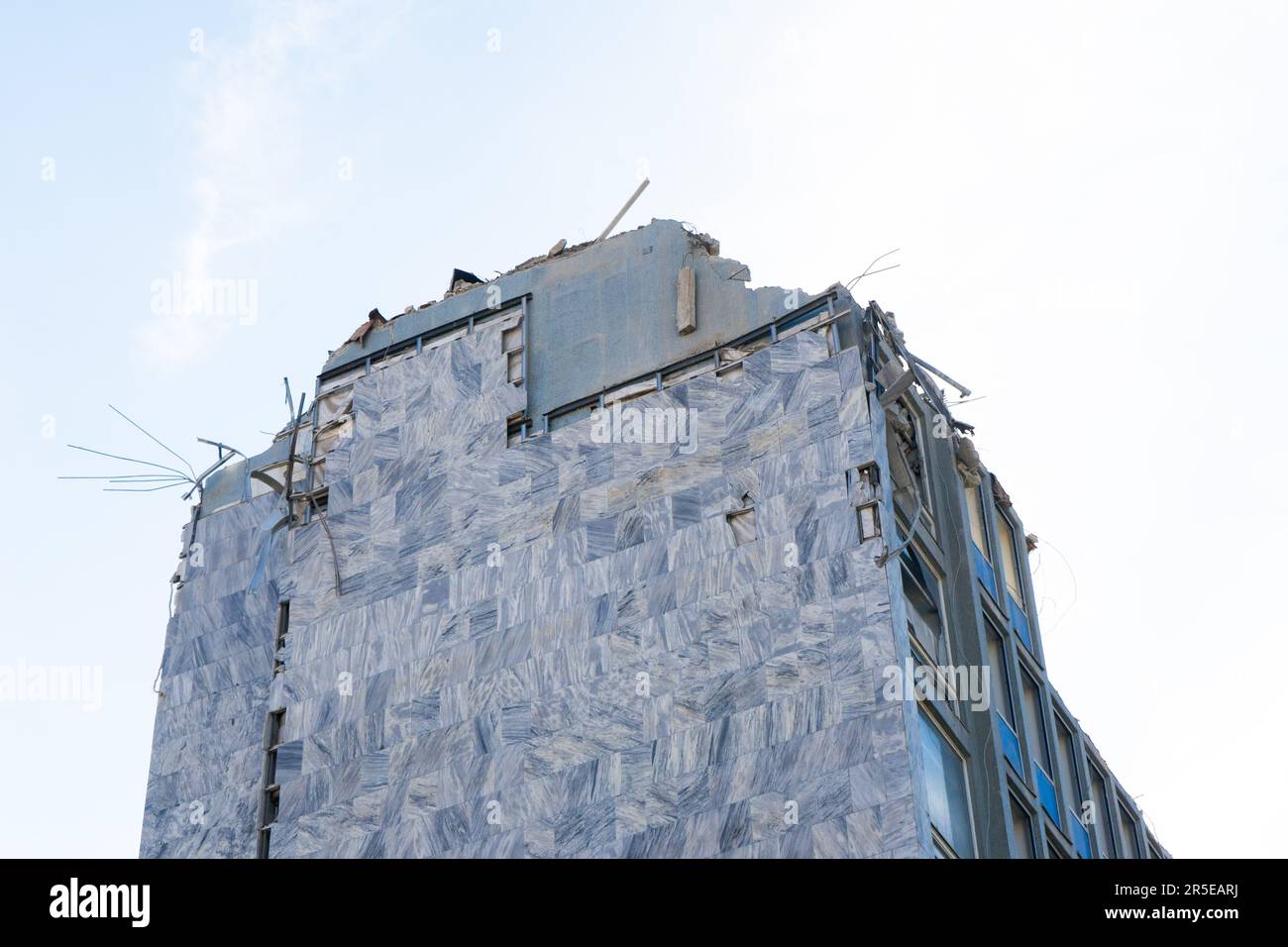 Background of process of demolition of building. Excavator breaking old ...